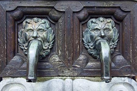 Fountain Heads on a little square in the Grand Beguinage of Leuven